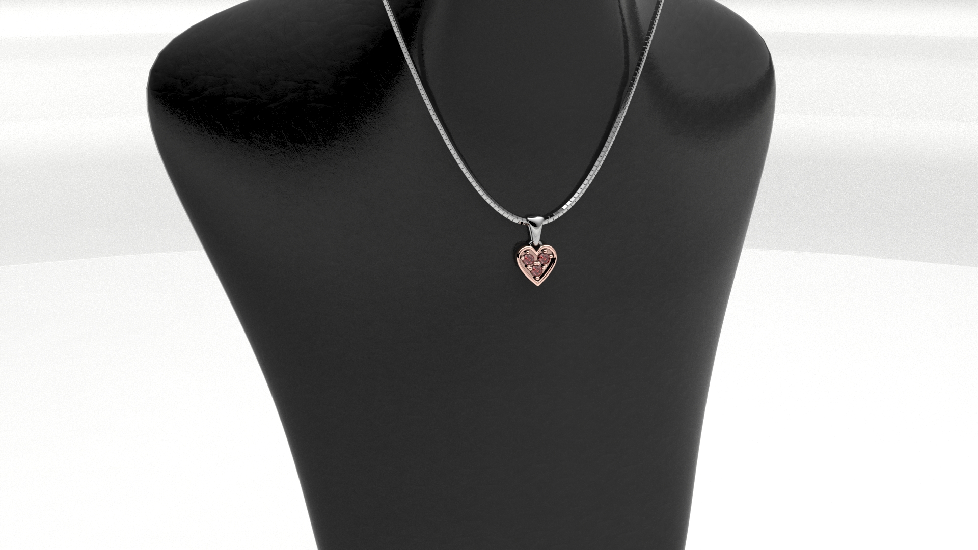 Collana cuoricino in oro rosé con rubini